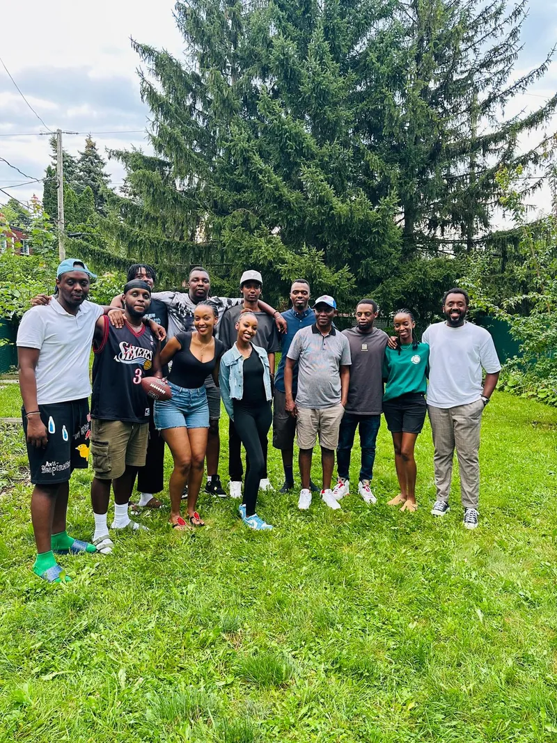 Young adults gathered on a lawn in August 2024